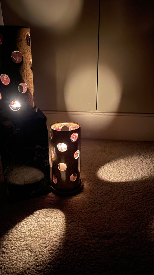 A large pair of ceramic tea light holders