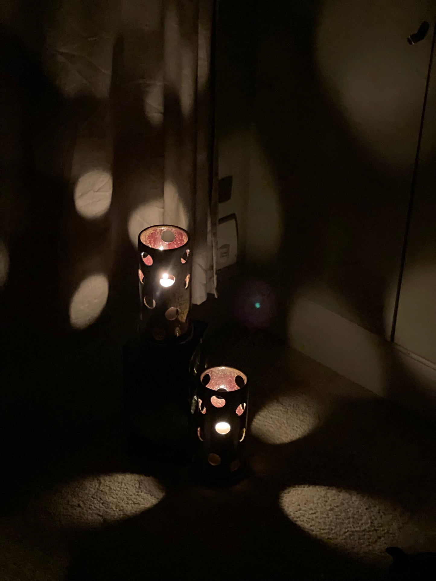 A large pair of ceramic tea light holders