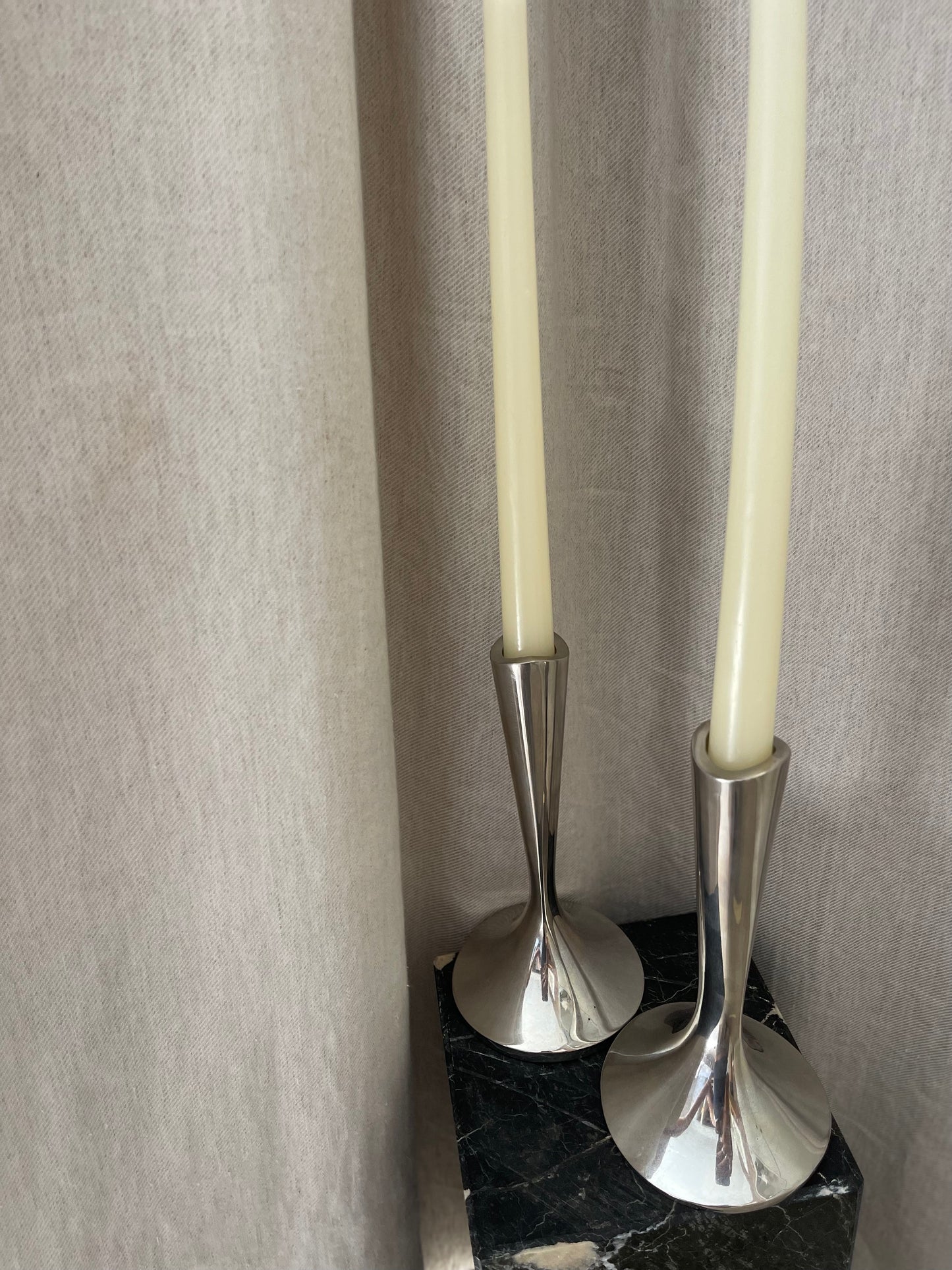 A pair of chrome Dansk candlesticks