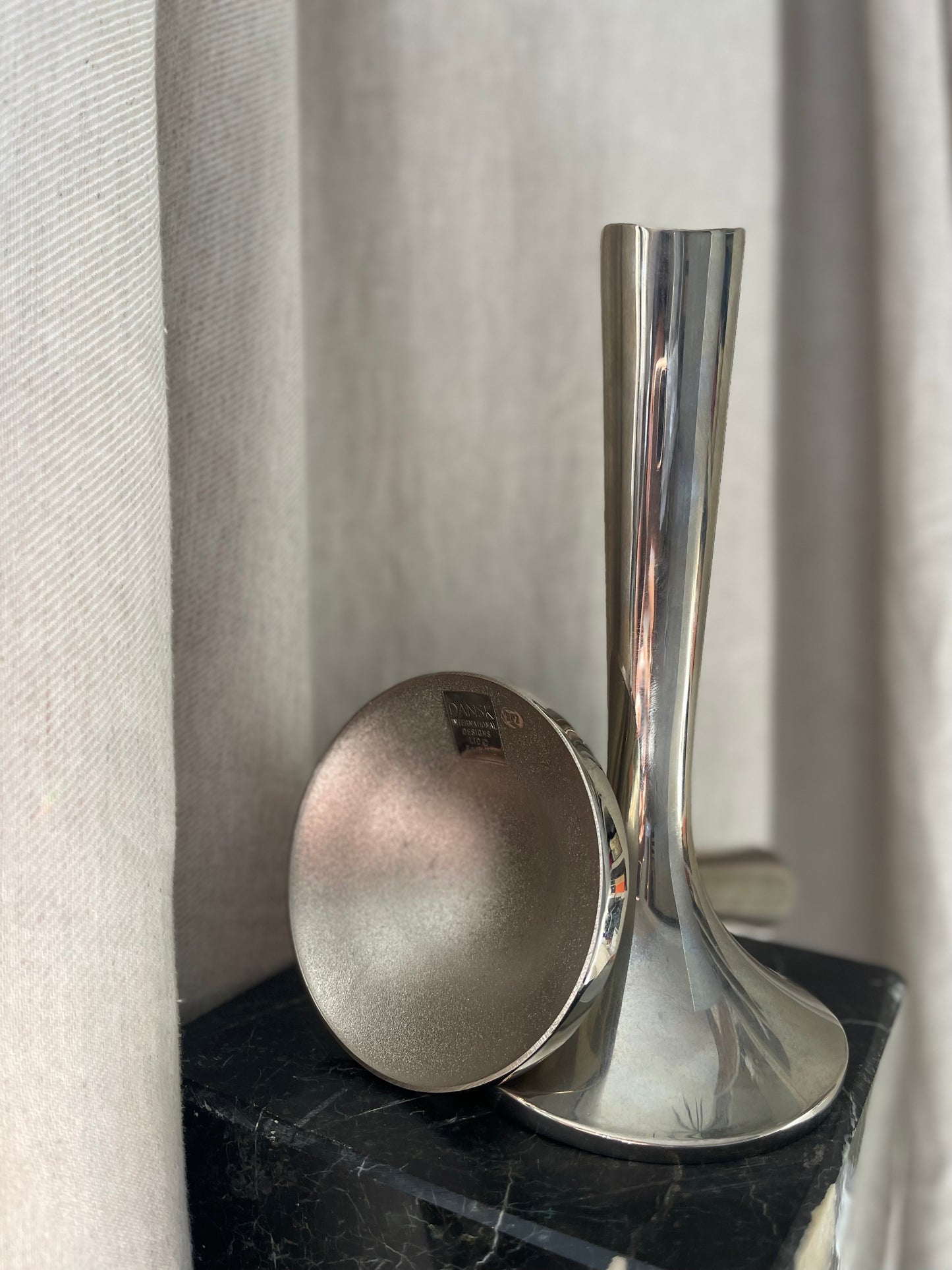 A pair of chrome Dansk candlesticks