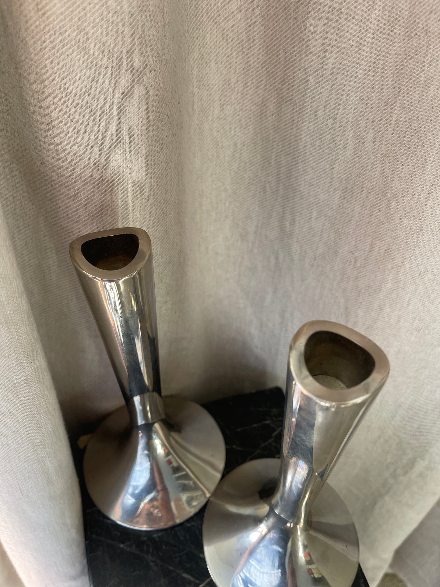 A pair of chrome Dansk candlesticks