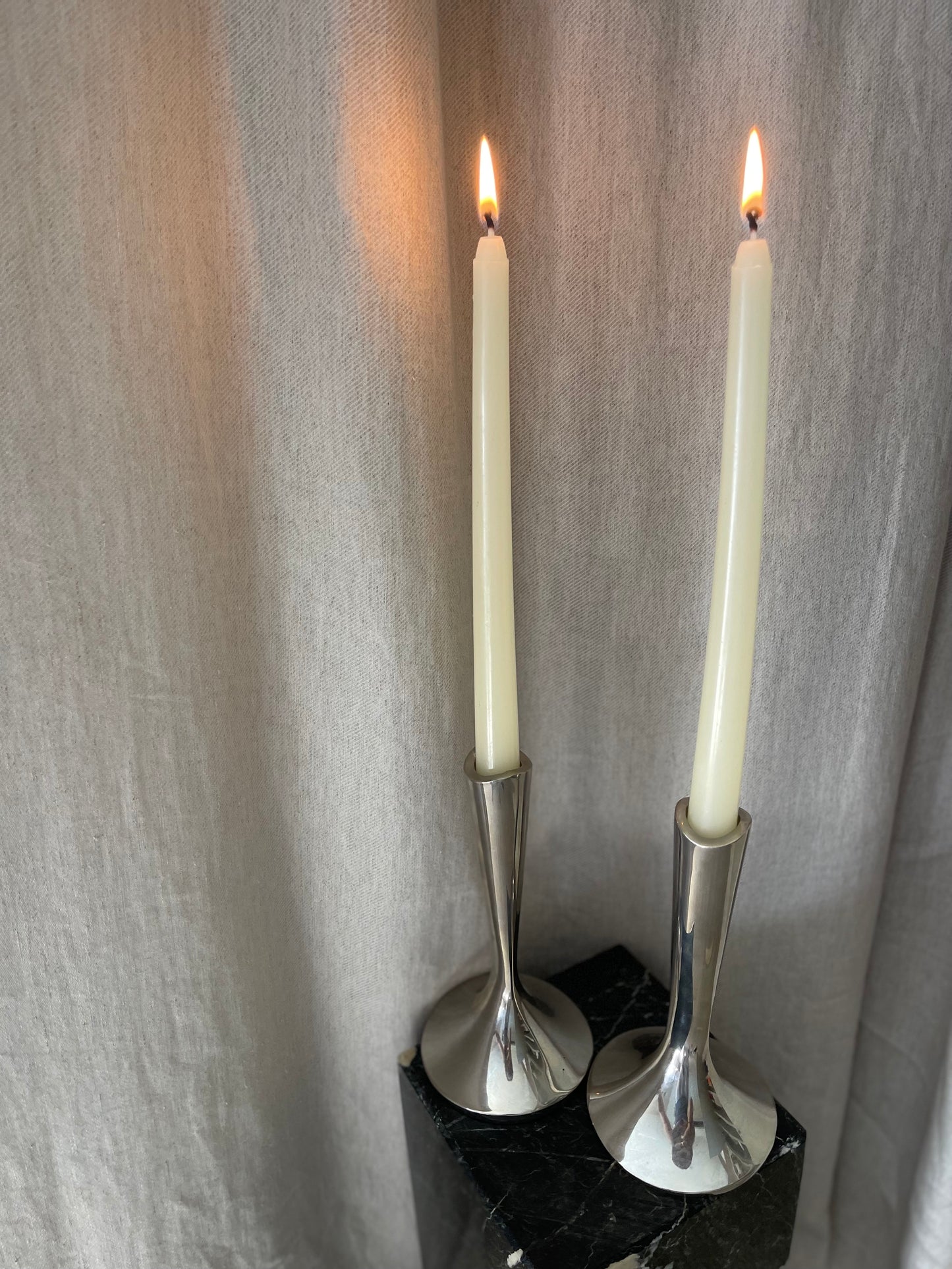 A pair of chrome Dansk candlesticks