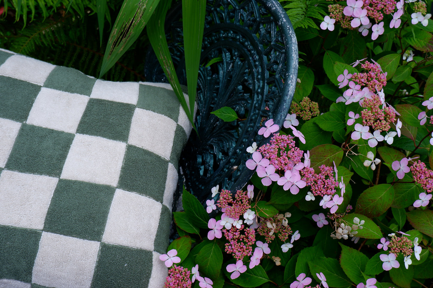 Green chequered towelling cushion