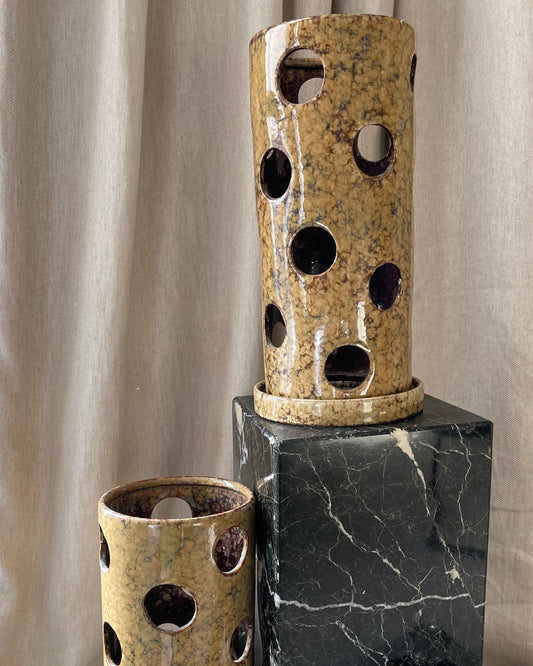 A large pair of ceramic tea light holders