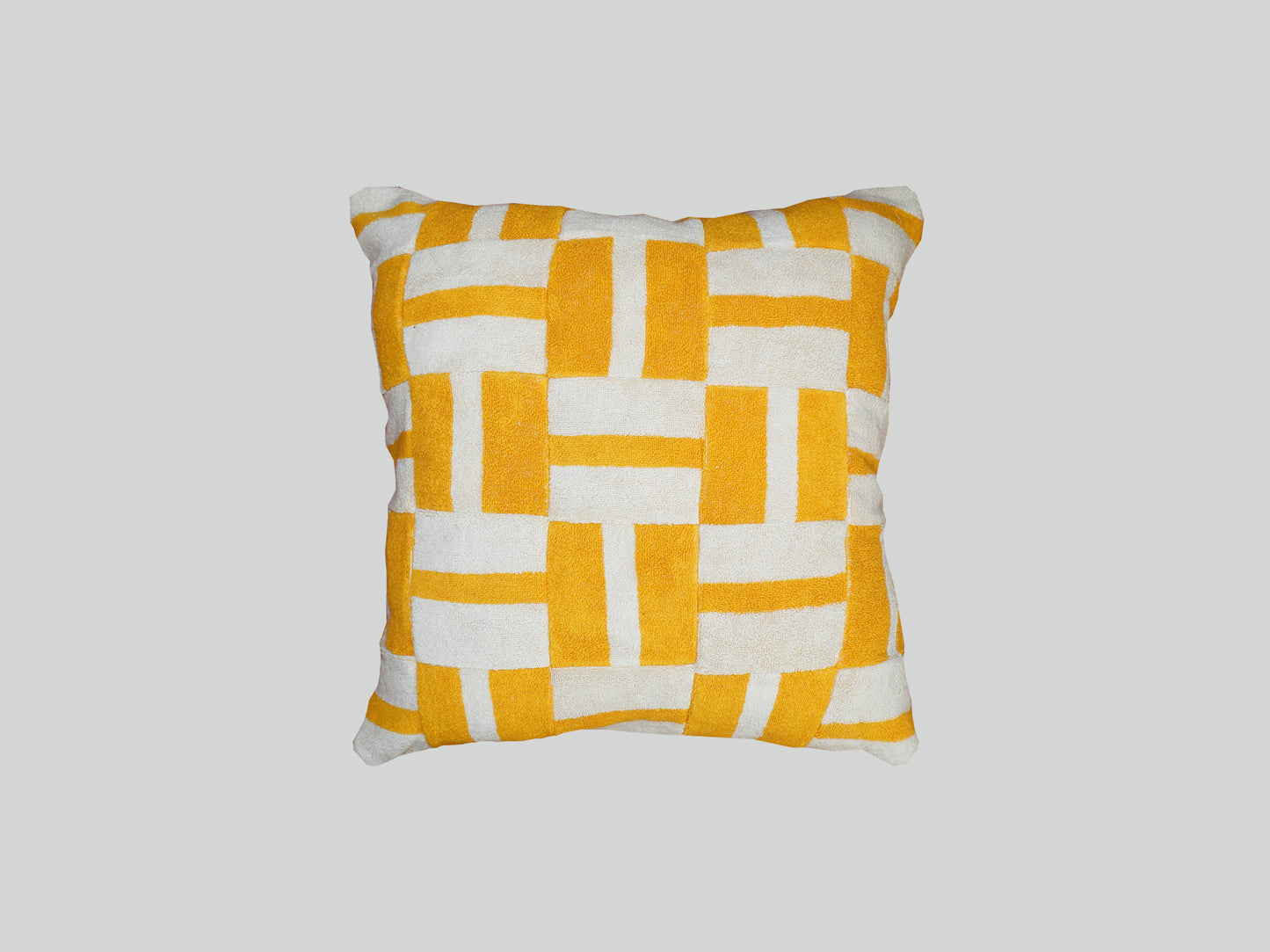 Geometric yellow towelling cushion