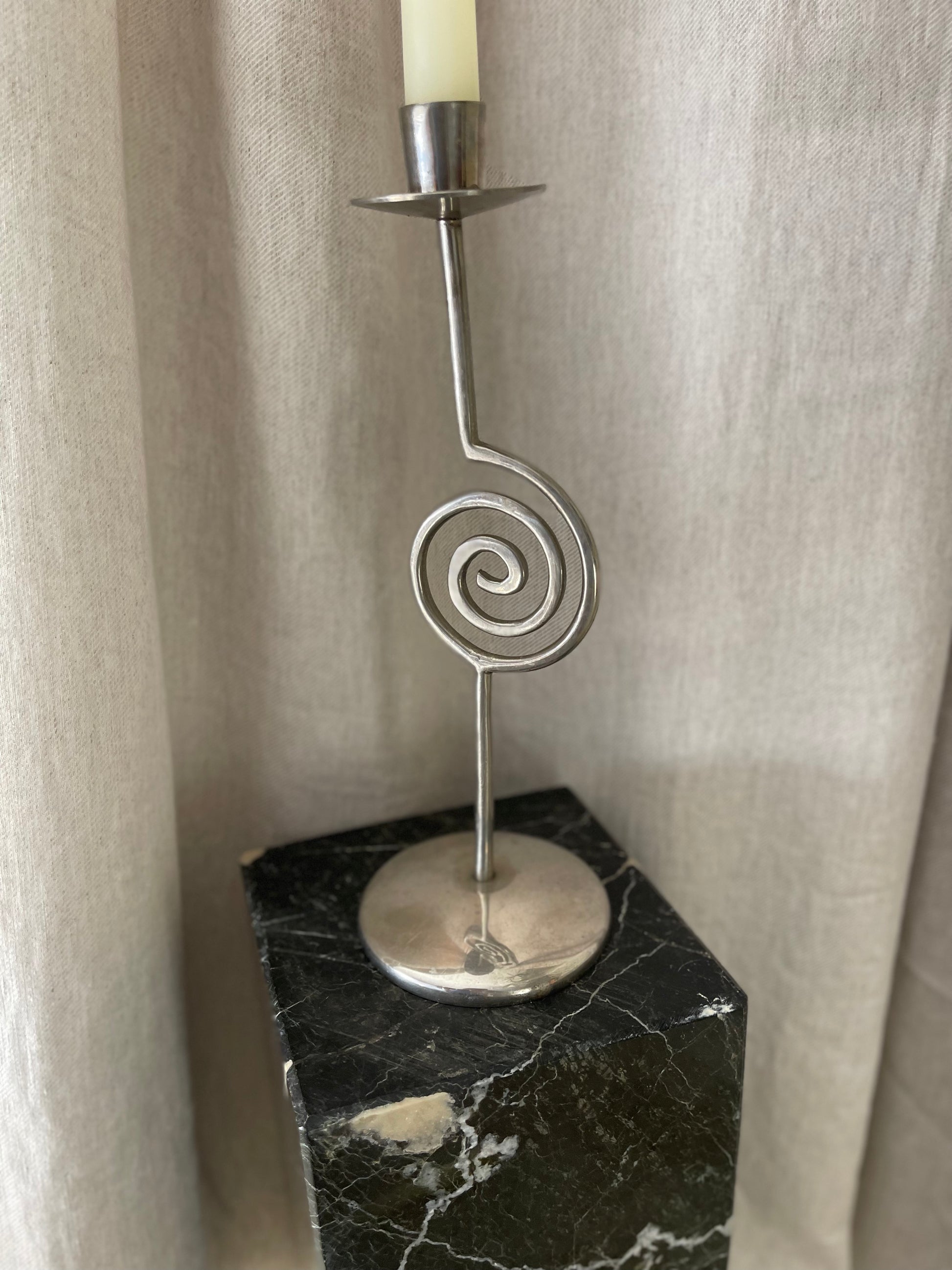 Candle holder in sprial design on marble base