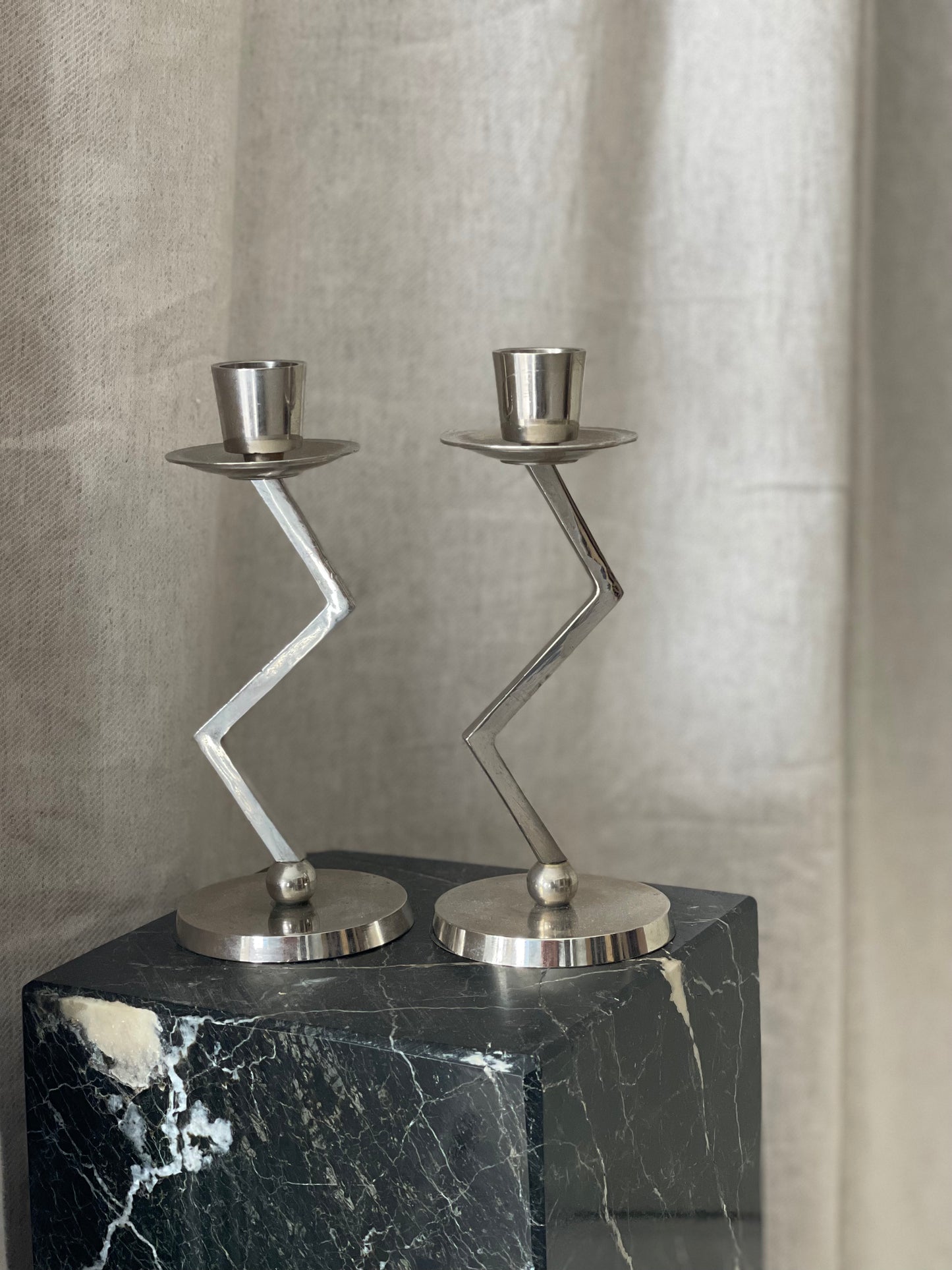 A pair of chrome Memphis zig zag candlesticks
