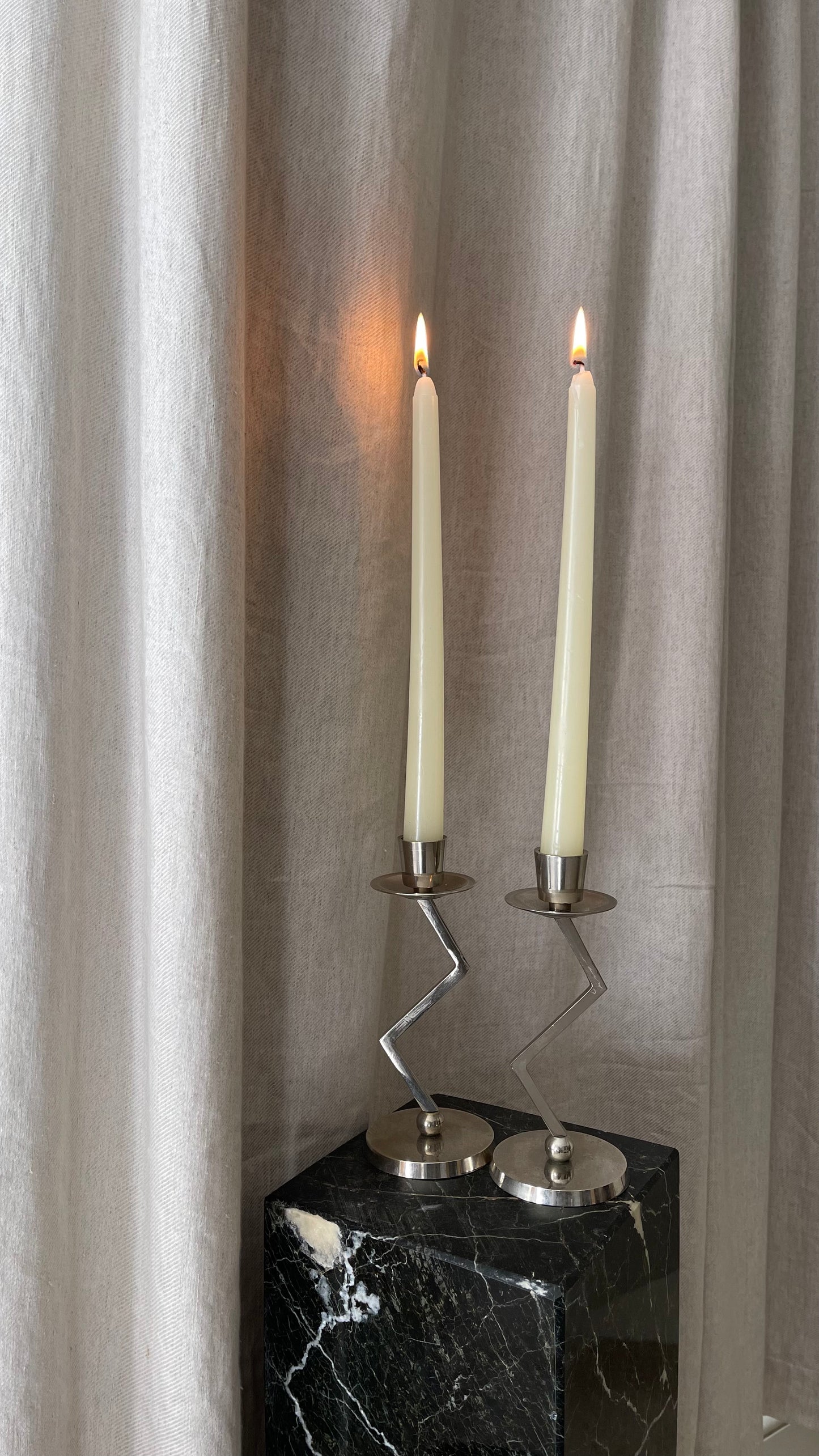 A pair of chrome Memphis zig zag candlesticks